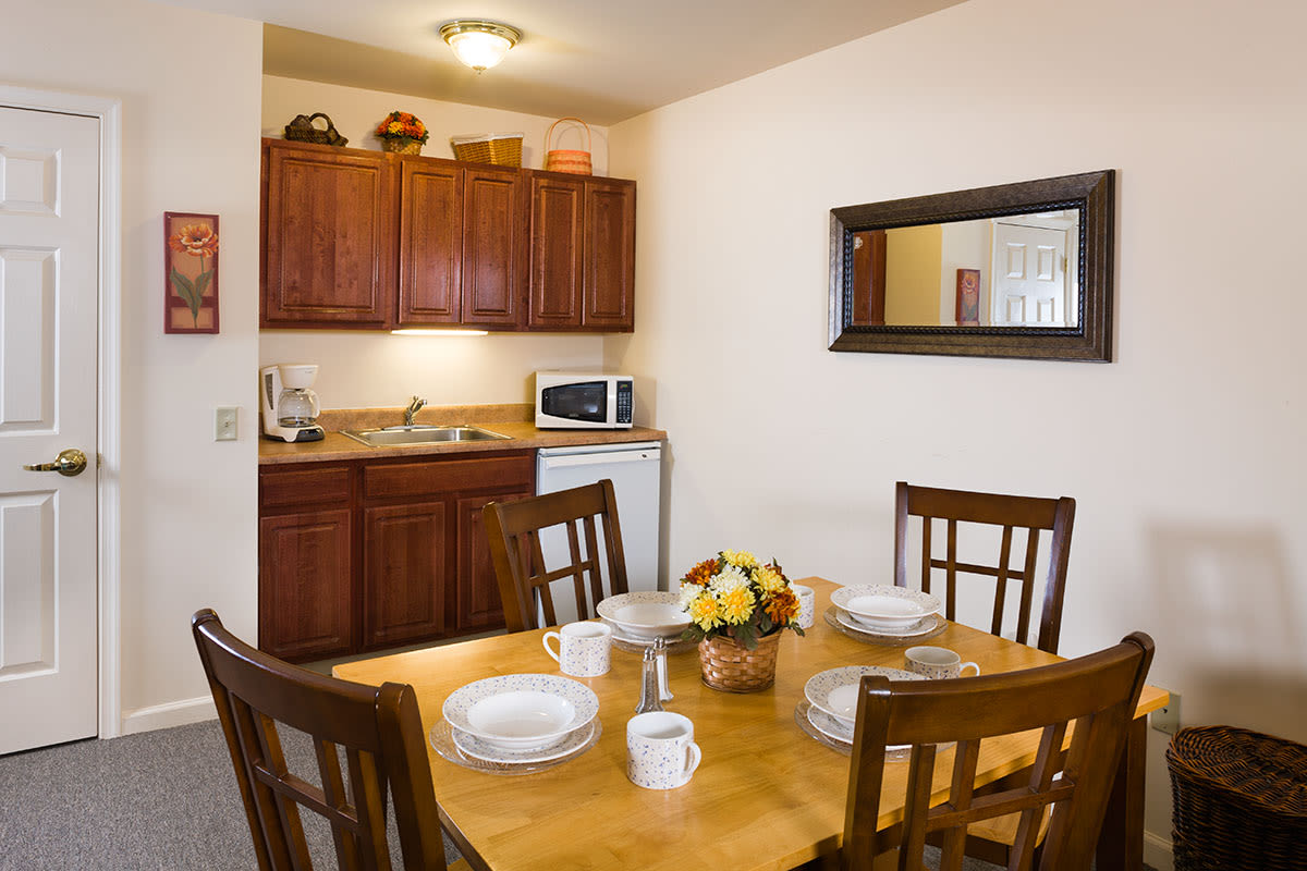 Cozy kitchenette with dining table set for four